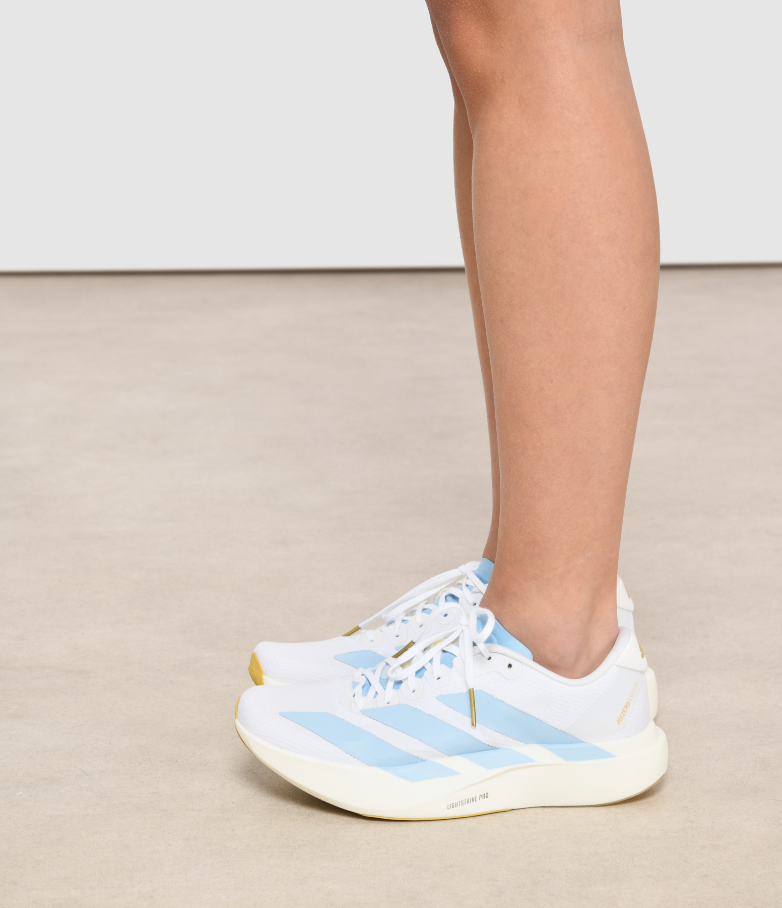 Adizero Evo Sl Woven M Ftwr trainers – White/Clear Blue/Matte Gold