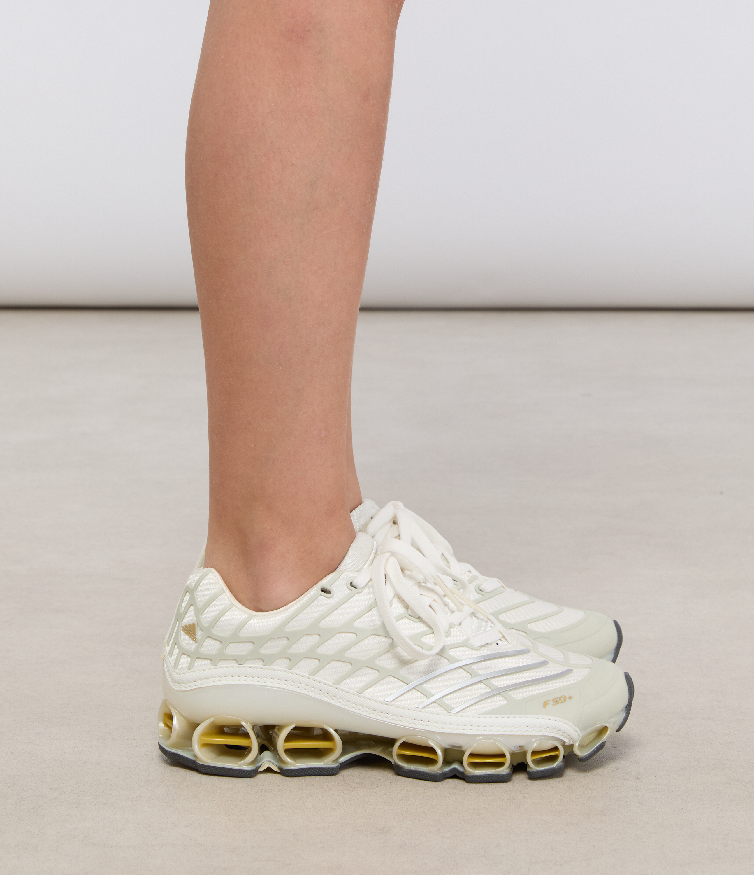 Megaride Cloud trainers in White/Ice Gold Metallic/Gold Metallic