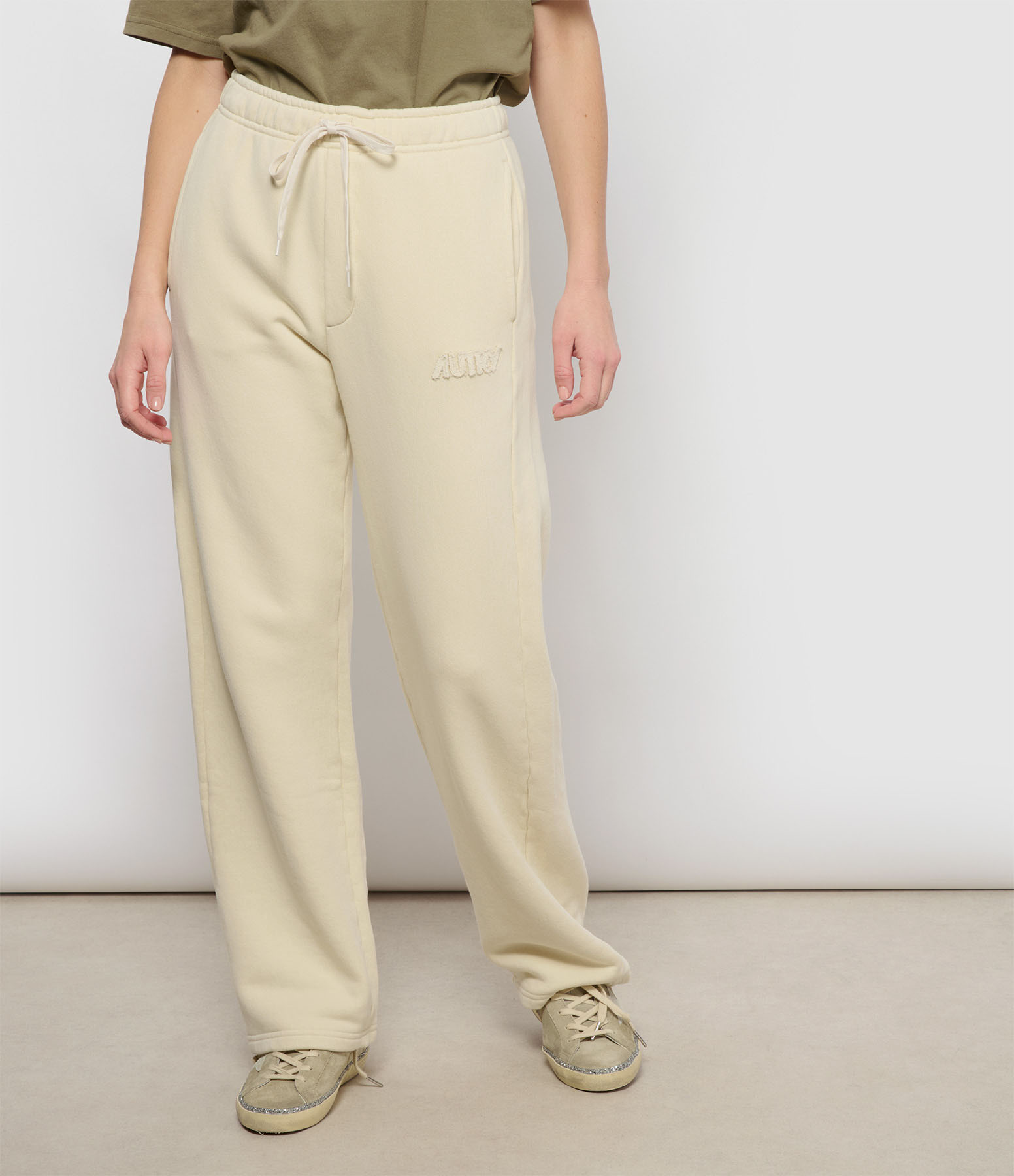 Cream-coloured jogging top