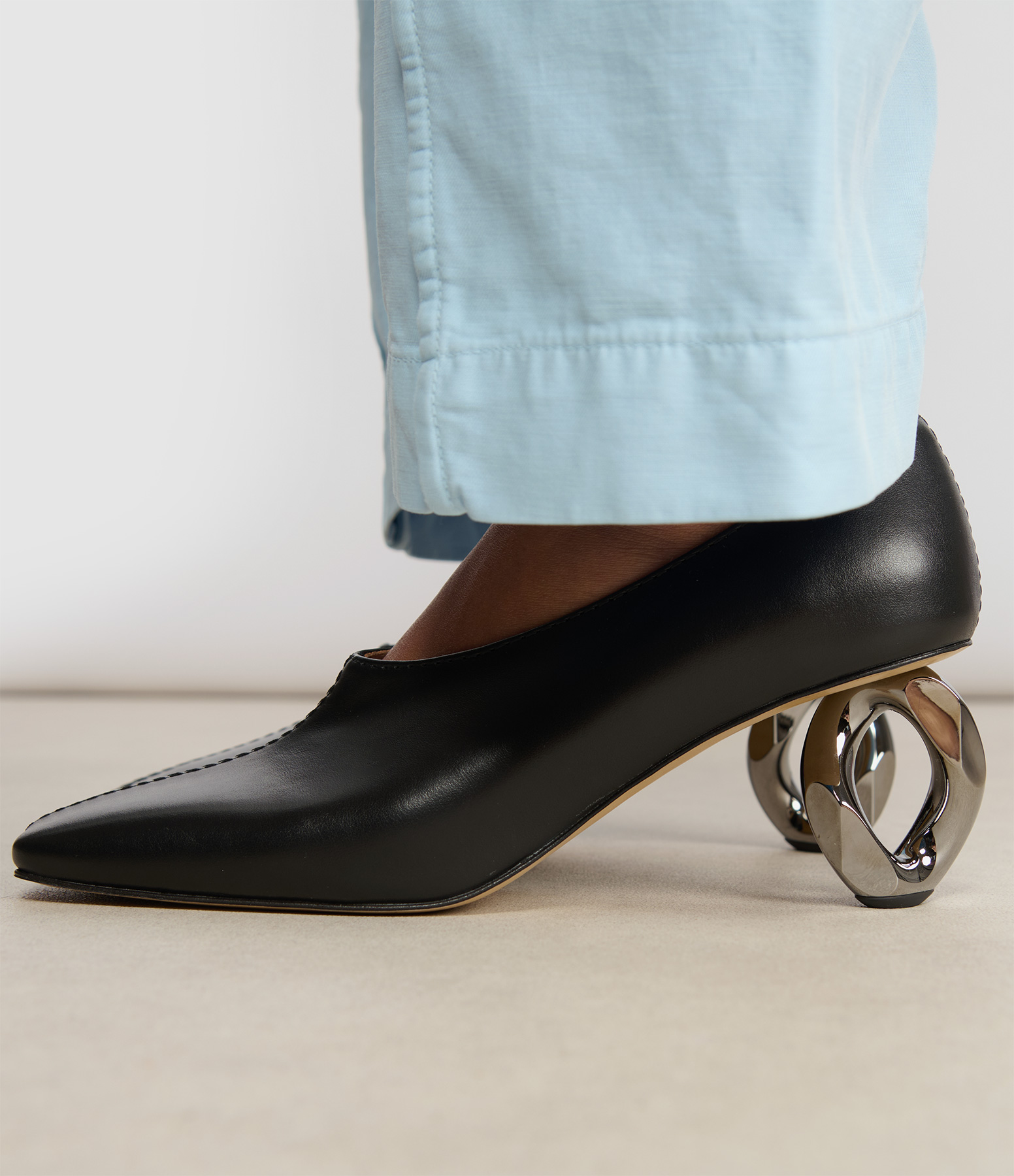 Stitch Chain Heel Pumps in Black
