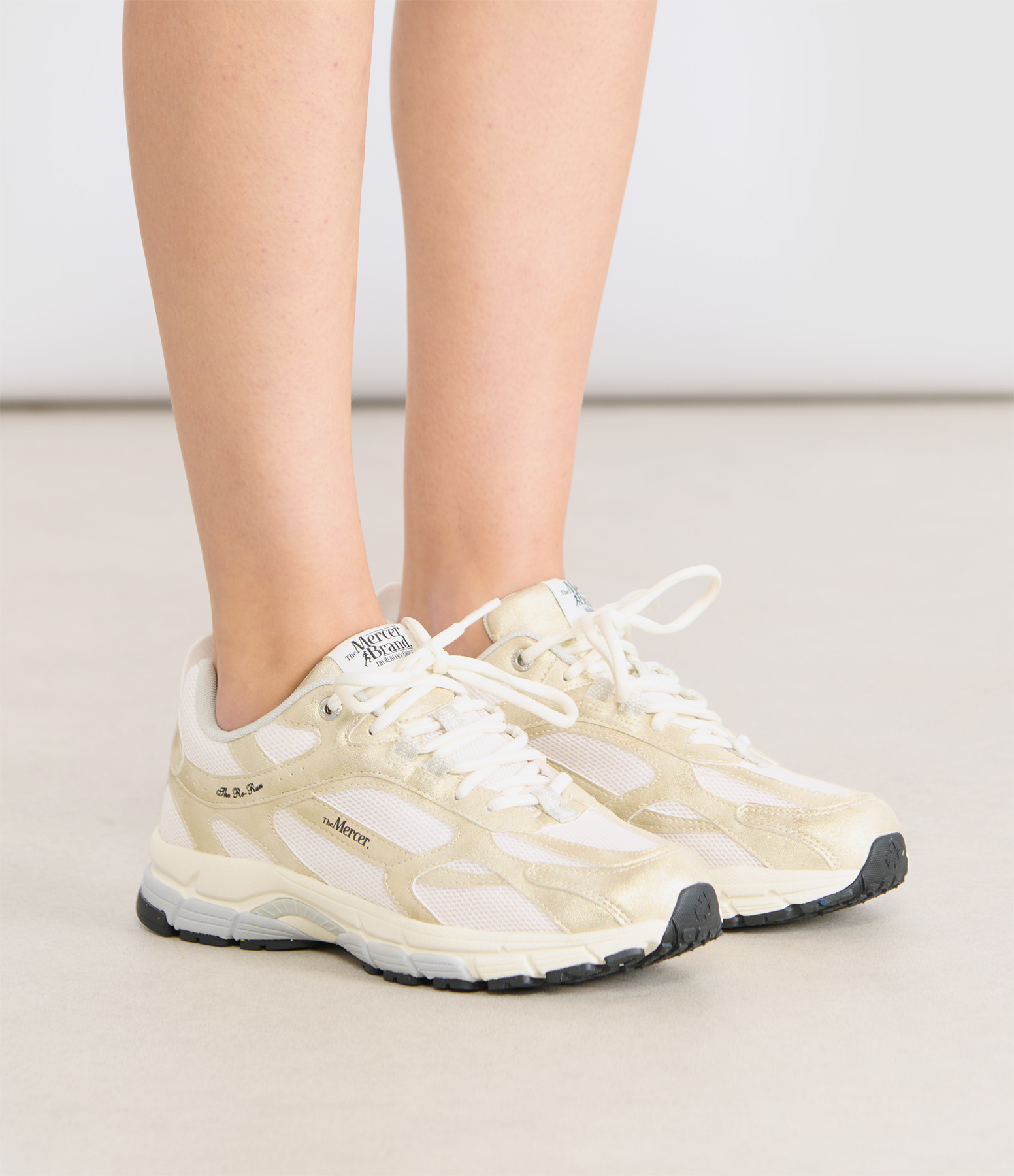 Re-Run Metallic Gold trainers