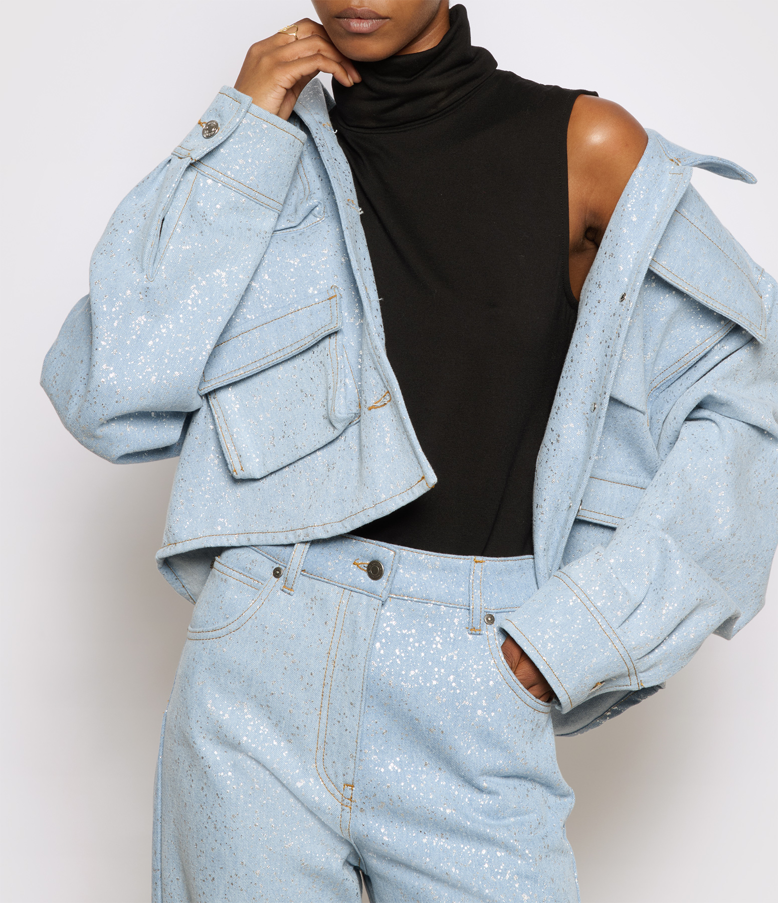 Sky-blue denim jacket with sequinned patches